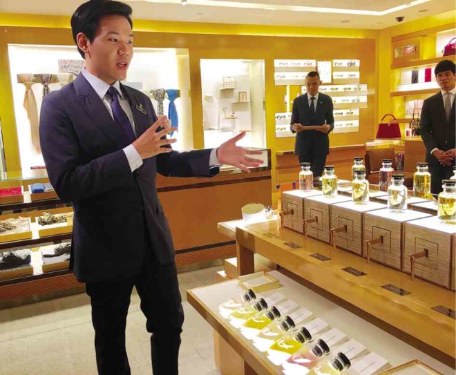 A Louis Vuitton executive in Greenbelt 4 presents the fragrance collection to the media.