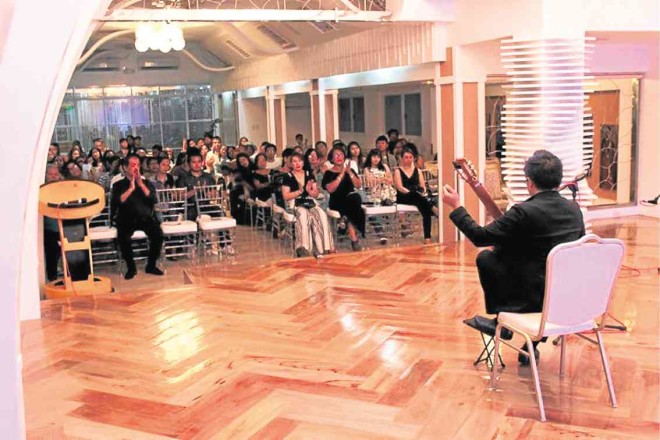 The audience at Regina Hall of Kemji Resort with classical guitarist Aaron Aguila. It is a night of the millennials, and some seniors, too. —PHOTOS BY FLOYD EVANGELISTA FLORES