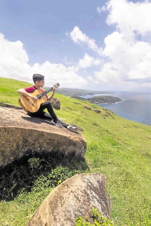 Classical guitarist Sting Asistores at Balacay Point in Catanduanes after the concert