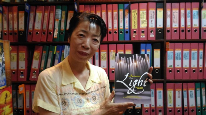 “There’s good lighting here.” Naomi “Shoko” Matsumoto holding her new book, “Awareness of Light.”—PHOTO BY TOTEL V. DE JESUS