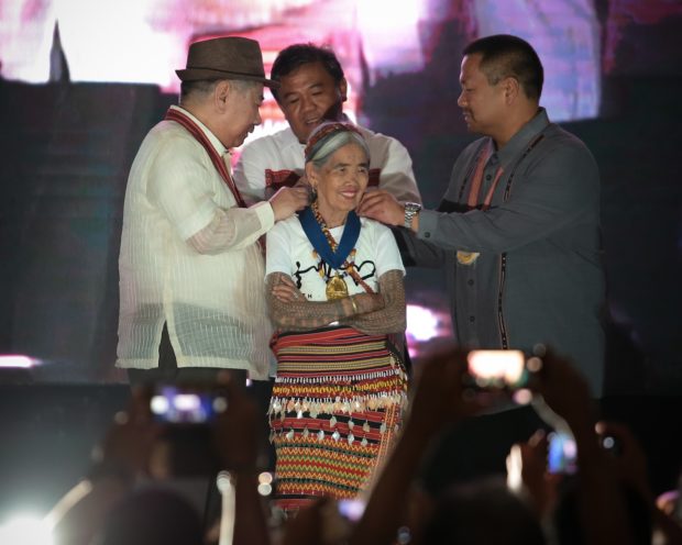 Apo Whang-Od is conferred the Dangal ng Haraya Award for Intangible Cultural Heritage by NCCA chairperson and National Artist for Literature Virgilio Almario, Provincial Vice Governor James Edduba and Sen. JV Ejercito, during a ceremony early this evening (June 25) at the Kalinga Capitol Plaza. JILSON SECKLER TIU