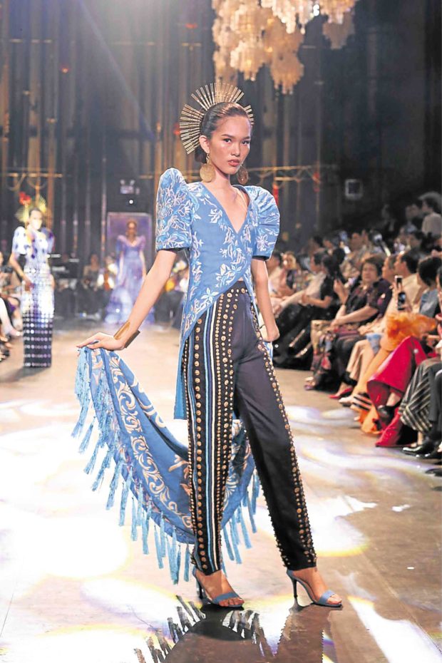 Len Cabili’s Tausug floral-embroidered top is teamed with pants, embellished with Tausug brass buttons.