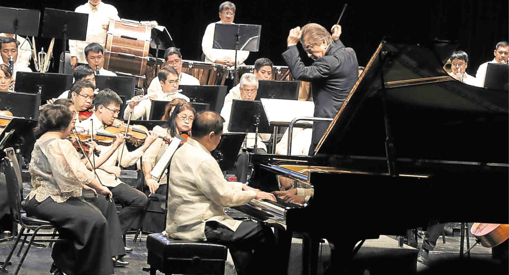 Pianist Raul Sunico performs with the Philippine Philharmonic Orchestra under musical director Yoshikazu Fukumura (right).