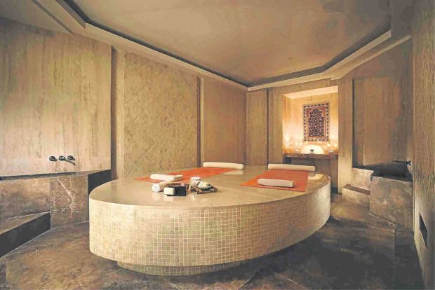 After a full-body steam, guests lie on the oval slab for an invigorating body scrub.