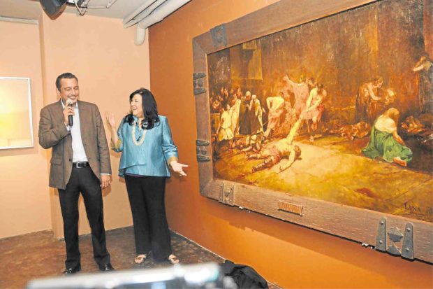 National Museum director Jeremy Barns and writer Lisa Guerrero-Nakpil unveil Antonio Dumlao’s copy of Juan Luna’s celebrated “Spoliairium” at León Gallery.