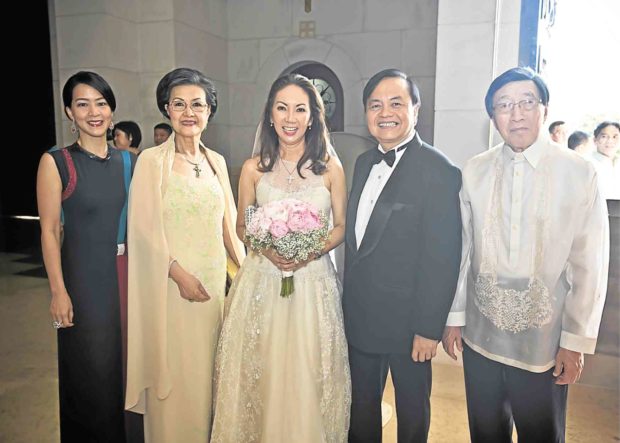 At the 30thwedding anniversary of author Chito Sobrepeña (in dark suit) and wife Anna are George and Mary Ty and their daughter Anjie Dy Buncio. George Ty agreed to stand as proxy for a principal sponsor who couldn’t attend the event.