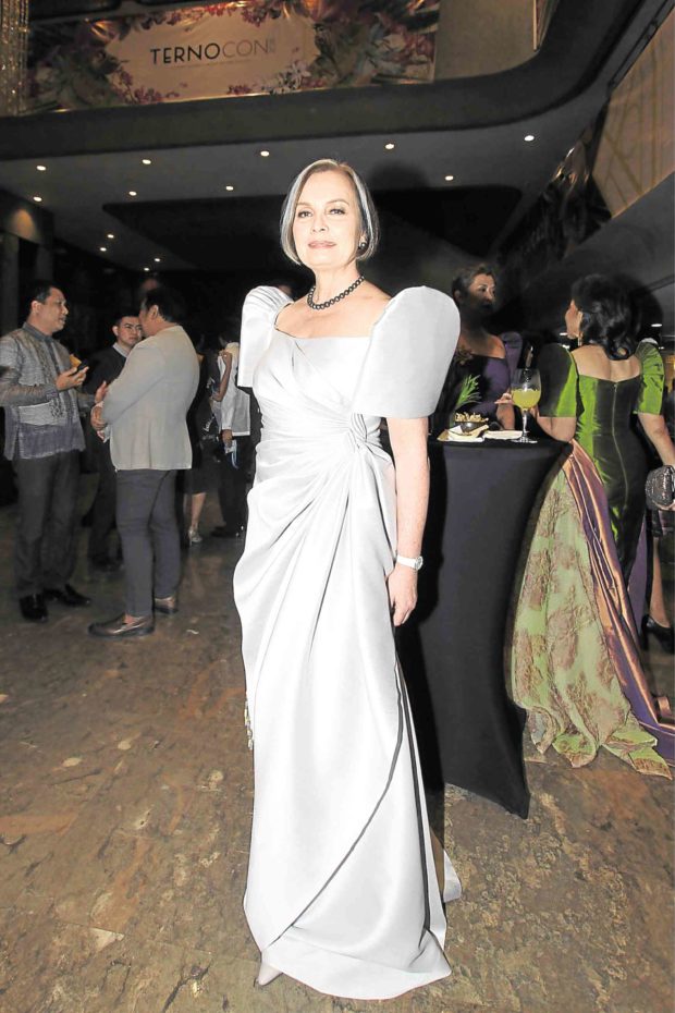 CCP chair Margie Moran Floirendo in a silk gazar draped gown. Cary Santiago picked the color from her silver streak.