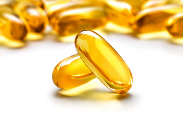 Yellow capsules supplement vitamins