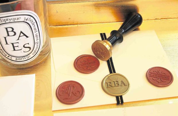 Monograms and wax seals lend a touch of Old World elegance.