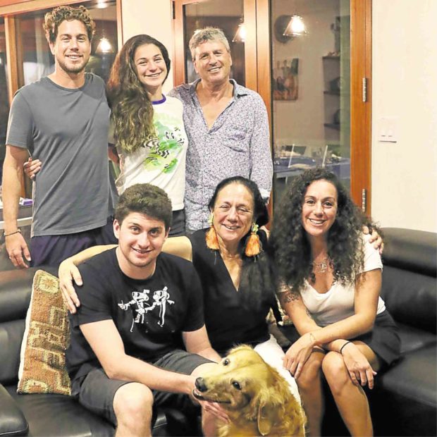 Navot Bornovski, owner of Fish ‘N’ Fins and Ocean Hunter, (standing, right) with his family, scuba instructor Udi, assistant professor Gaily, (seated) musician Liam, wife and partner Tova and doctor Yarden