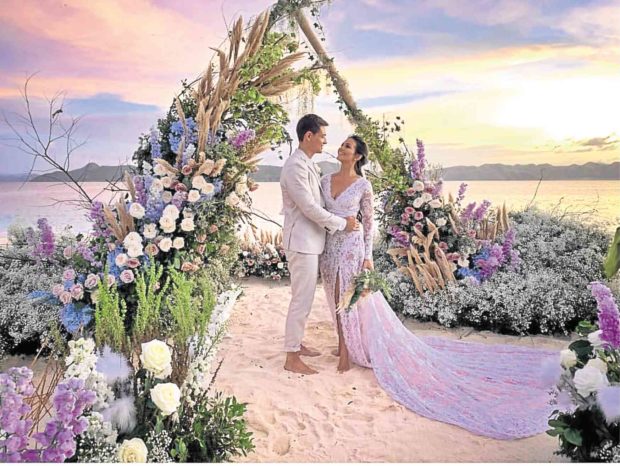 The newlyweds after the ceremony, with the Coron sunset as backdrop —INSTAGRAM @GIDEONHERMOSA