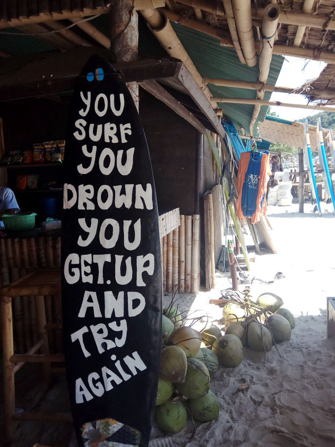 Never give up: A surfboard provides encouragement for new surfers. -/Vyara Wurjanta