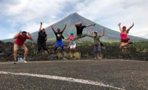 Jumping for joy with Mayon as a backdrop