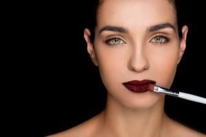 woman lipstick brows brush