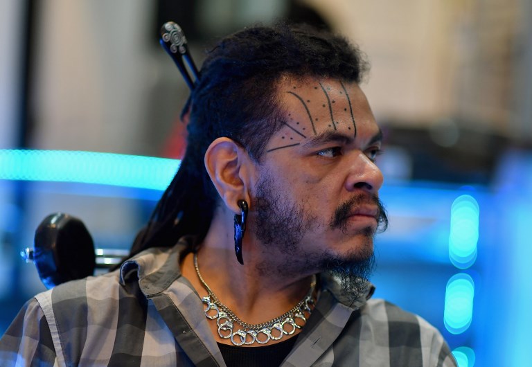 Armando Guevara works at Andromeda Studio 33 tattoo parlor on January 23, 2019, in the East Village in New York. - Face tattoos, once limited to only a very small group of people, have gained new popularity thanks to today's rappers -- but some artists are reluctant to make such a permanent change to a client's appearance. (Photo by ANGELA WEISS / AFP)