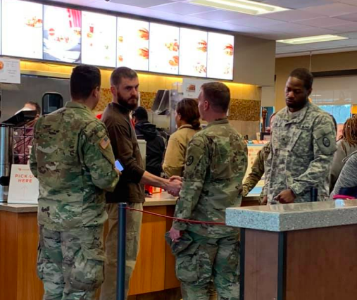 Man buys food for soldiers