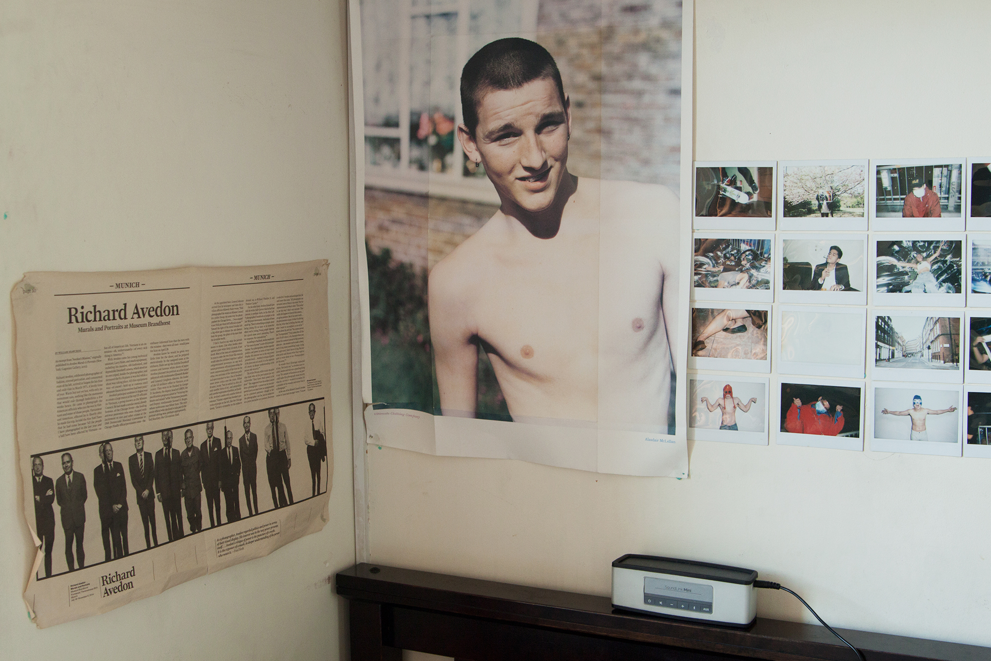 A nook at Jack’s place, featuring polaroids, an Alasdair McLellan poster, and a newspaper spread on Avedon from Paris. PHOTO © JED GREGORIO