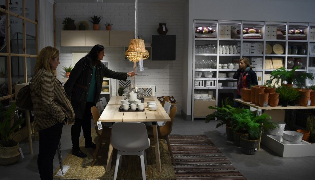Women visit a store of the Swedish furniture giant Ikea in Madrid city center on October 10, 2018. (Photo by GABRIEL BOUYS / AFP)