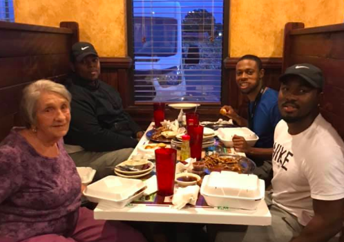 Young men joins elderly widow eating alone