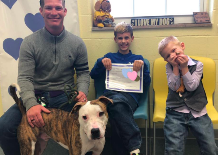 Family adopts boy, dog on the same day