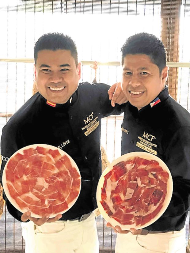 Michael (left) and Mark Lopez with their prized hams: Jamon  Iberico de Cebo and Jamon Iberico de Bellota