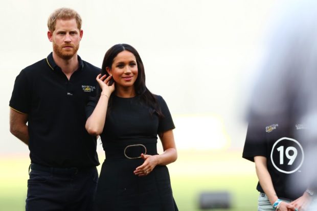 LONDON, ENGLAND - JUNE 29: Prince Harry, Duke of Sussex and Meghan, Duchess of Sussex look on during the pre-game ceremonies before the MLB London Series game between Boston Red Sox and New York Yankees at London Stadium on June 29, 2019 in London, England.   Dan Istitene - Pool/Getty Images/AFP