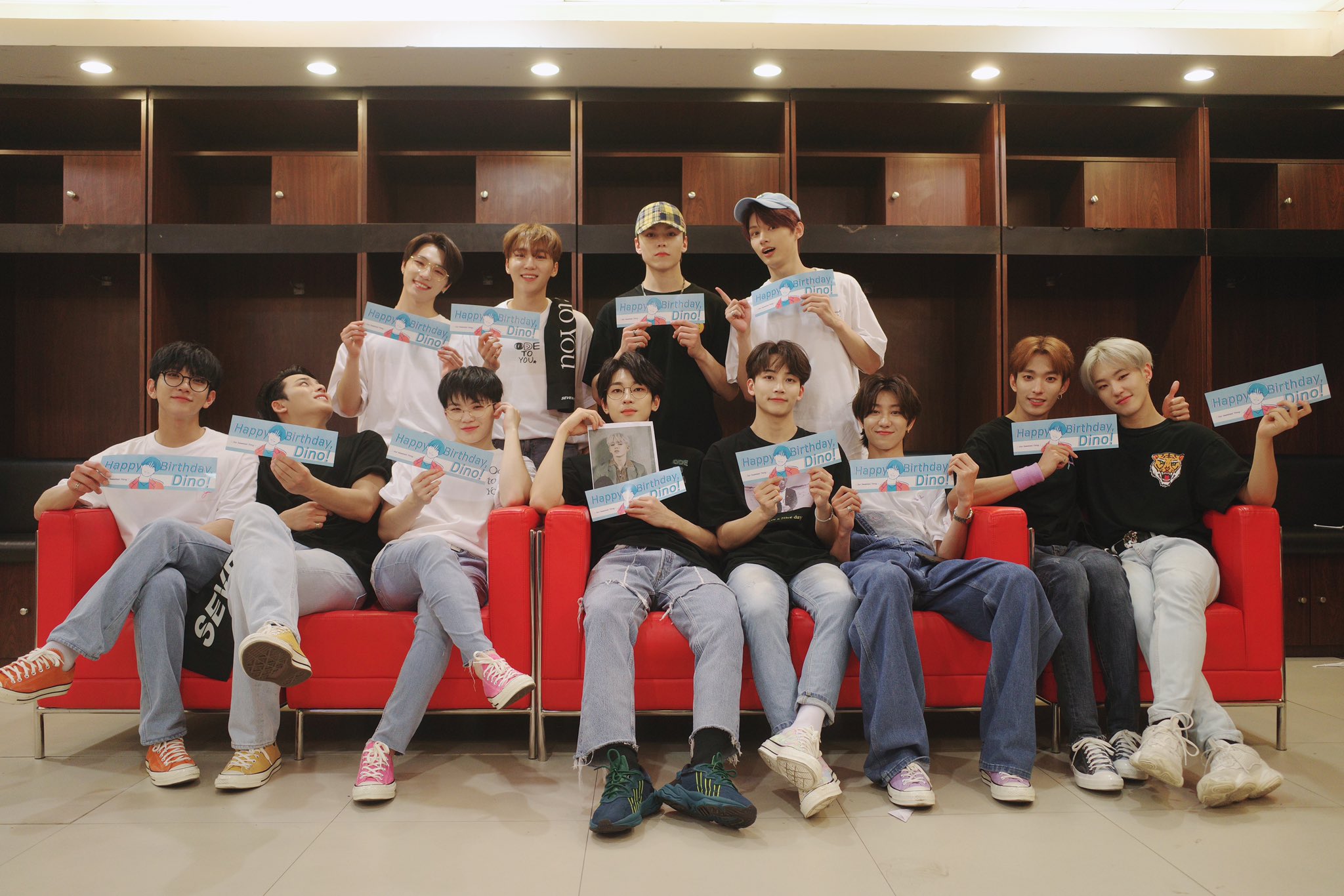 Holding banners to celebrate the birthday of “maknae” (youngest) Dino, the members also pose with a photo of leader S.Coups, who is still on hiatus. —SEVENTEEN OFFICIAL TWITTER
