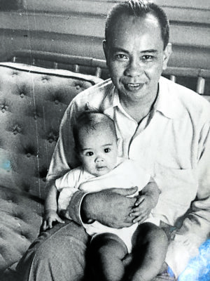 E. Aguilar Cruz with an infant Therese--HAU-CKS FILES.