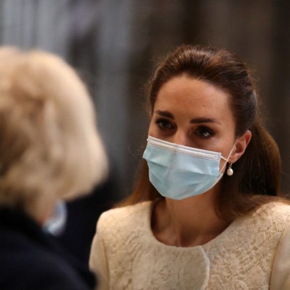 Britain's Catherine, Duchess of Cambridge (R) speaks to health workers as she visits the coronavirus vaccination centre at Westminster Abbey, central London on March 23, 2021, to pay tribute to the efforts of those involved in the Covid-19 vaccine rollout
