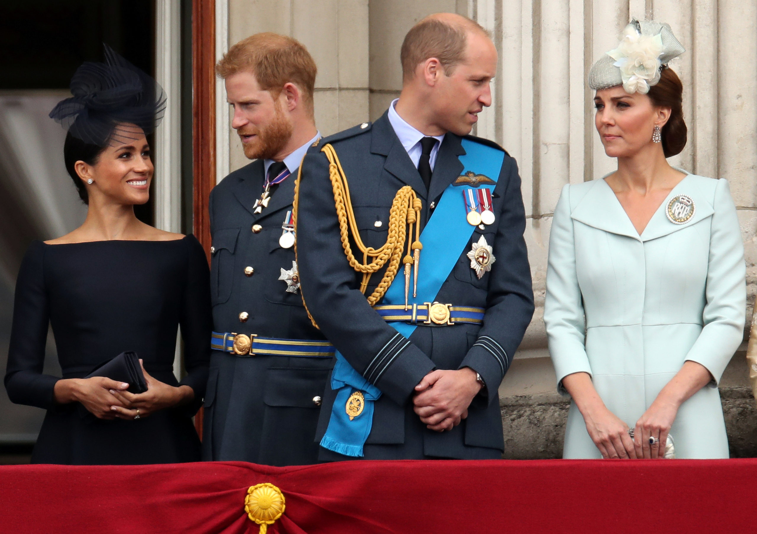 Britain's Meghan, Duchess of Sussex, Prince Harry, Prince William, Catherine, Duchess of Cambridge stand on the balcony of Buckingham Palace as they watch a fly past to mark the centenary of the Royal Air Force in central London, Britain July 10, 2018