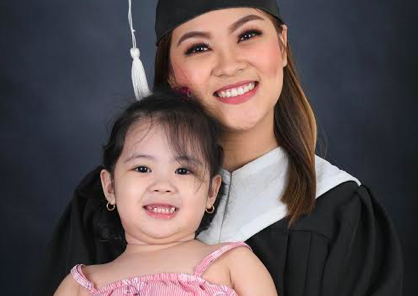 Rose and her daughter Potchay during her graduation.