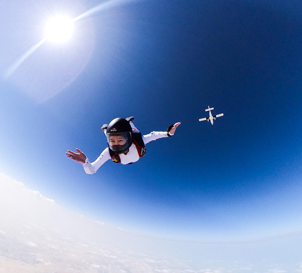 Justine Suva Alfonso makes a wave at the camera in an exhilarating skydive in Abu Dhabi
