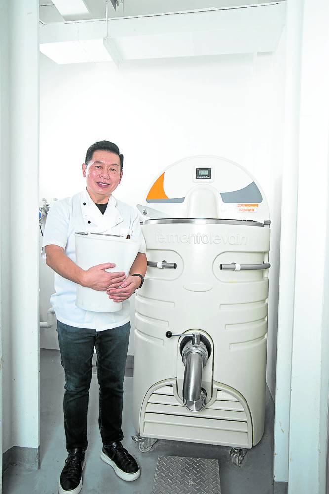 Johnlu Koa beside the sourdough machine