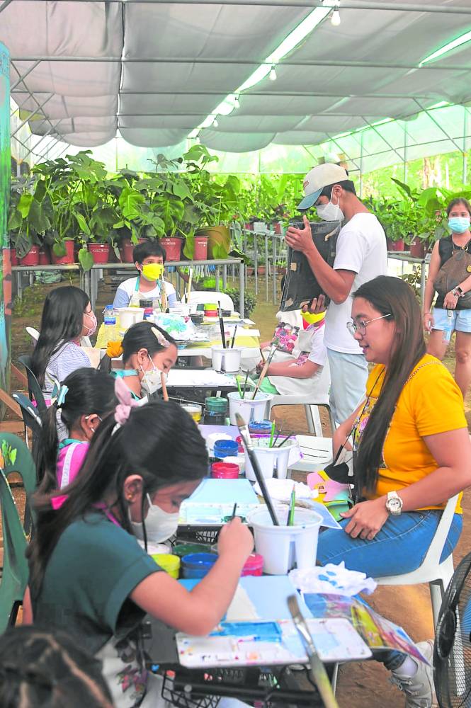 Pascual is the head teacher in Play and Paint sessions of Artreach at the Hidden Charm Café in Silang, Cavite