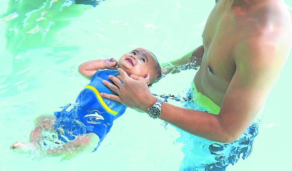 Nine-month-old baby has swimming lessons at Aqualogic.
