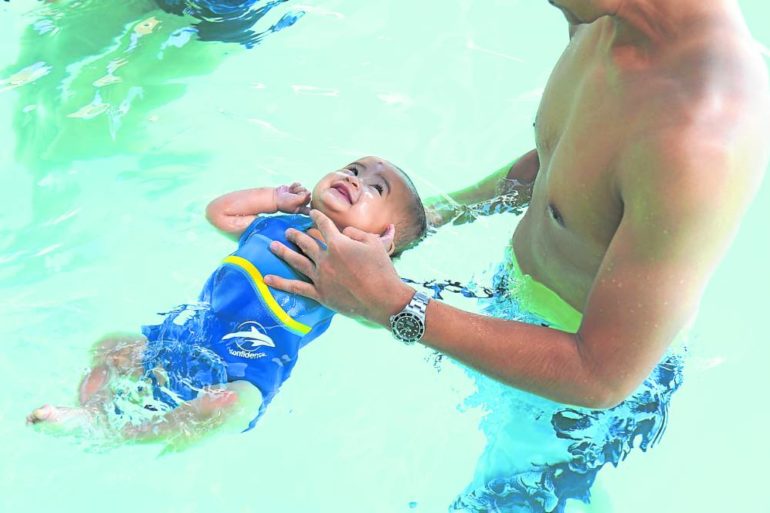 Nine-month-old baby has swimming lessons at Aqualogic.