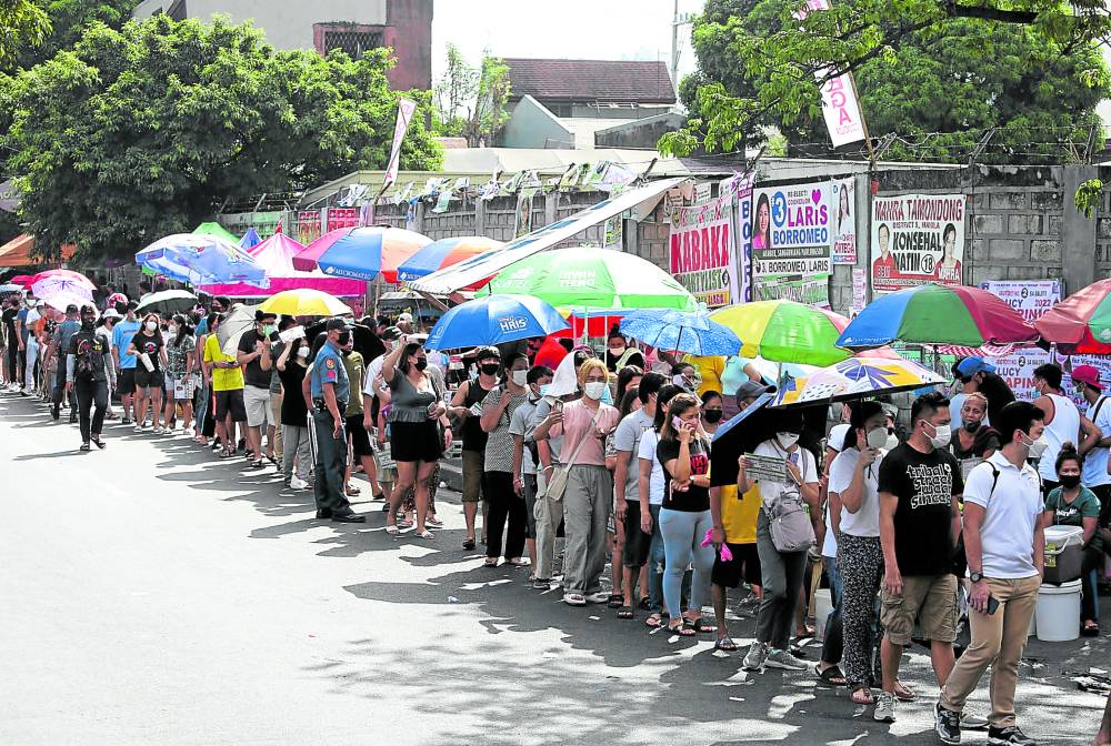 Voters line up at Rafael Palma Elementary School in Manila