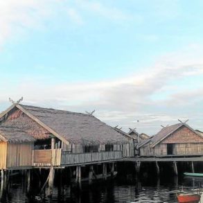Tabawan Langgal (below), wooden communal buildings