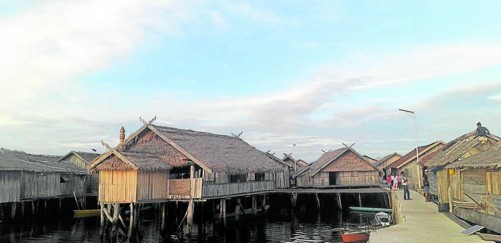 Tabawan Langgal (below), wooden communal buildings