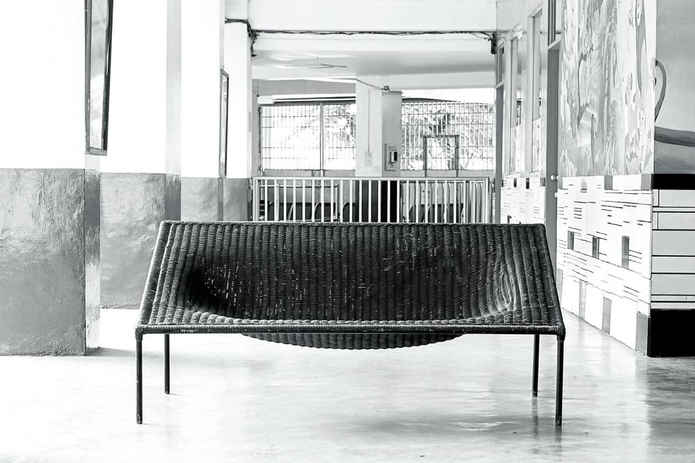 Duyan Chair, a woven wicker chair with a cavity for the sitter, inspired by the native hammock
