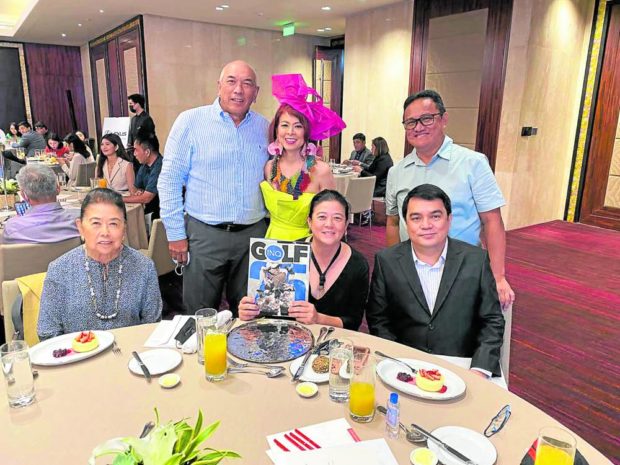 Inquirer family, seated: Marixi Prieto, Sandy Prieto-Romualdez, Inquirer president and CEO Rudyard Arbolado; standing: Arsenic Laurel, Sea Princess, Jong Arcano 