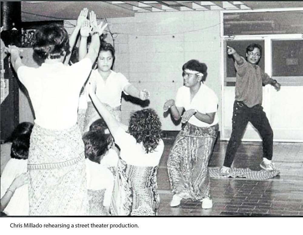 A young Chris Millado (right) conducting a community  theater workshop