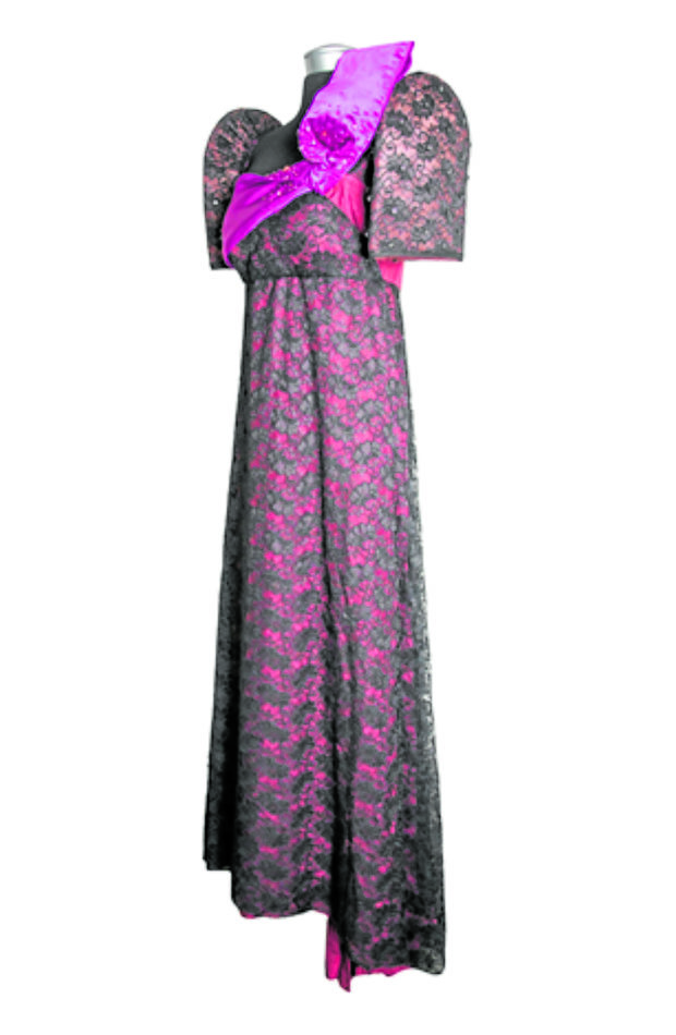A two-toned terno with a black lace overlay on an empire-cut magenta gown, accented by an oversized lilac bow embellished with beads