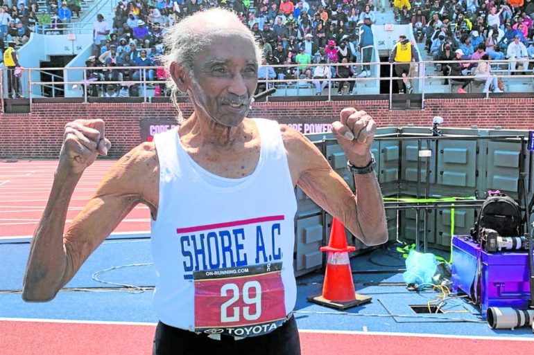 Centenarian Lester Wright’s victory pose after his record-setting 100-meter run in this year’s Penn Relays