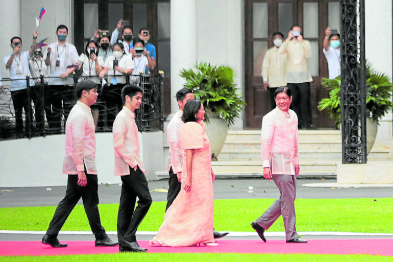President Ferdinand Marcos Jr., in Pepito Albert, leads his wife and sons into Malacañang after Thursday’s inauguration