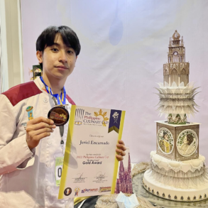 Jeriel Encarnado with his prize-winning cake design. Image from his Facebook account