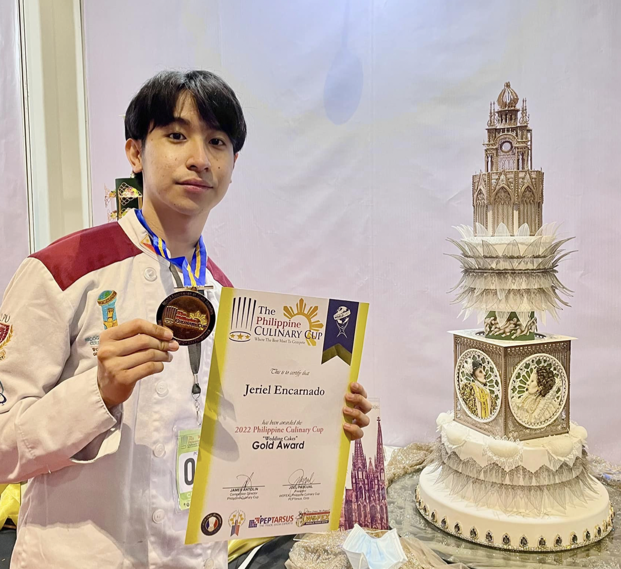 Jeriel Encarnado with his prize-winning cake design. Image from his Facebook account