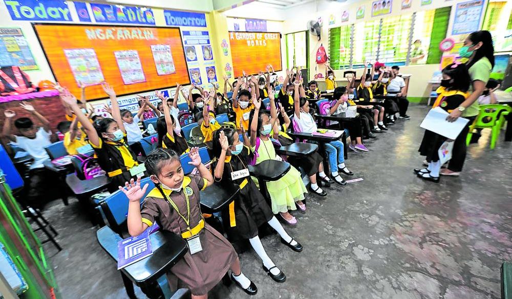 First graders in a Quezon City school on their first day of face-to-face classes —GRIG C. MONTEGRANDE