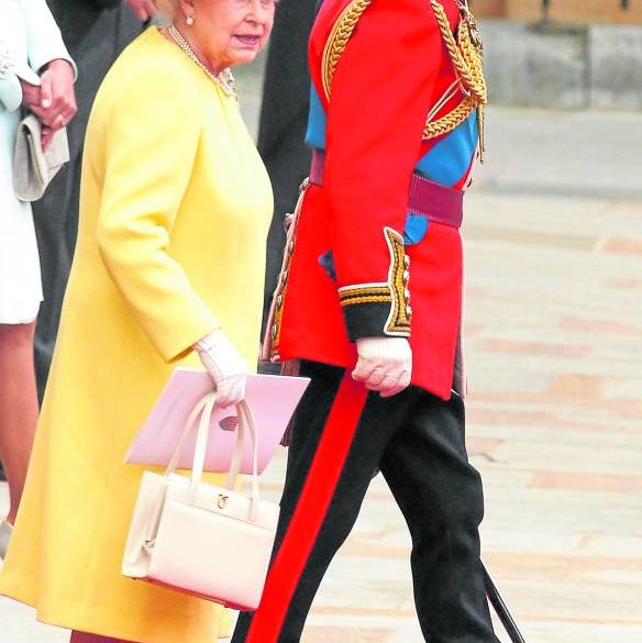 The late queen had a precise fashion formula that included her now iconic handbags.