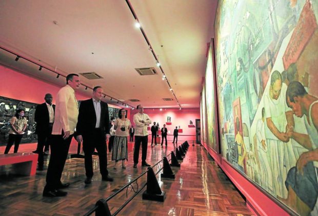 Barns, Emhoff and museum trustees view the oil mural by Carlos “Botong” Francisco at the National Museum of Fine Arts, Manila, on Tuesday. —LYN RILLON